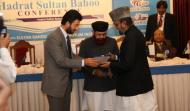 Sahibzada Sultan Ahmad Ali and Syed Hamid Saeed Kazmi  Presenting Shield to Syed Haroon Ali Gillani 