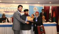 Sahibzada Sultan Ahmad Ali and Syed Hamid Saeed Kazmi Presenting Shield to Dr. Farid-ud-Din Khan
